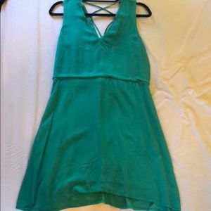 Flattering green dress with lace up back detail.